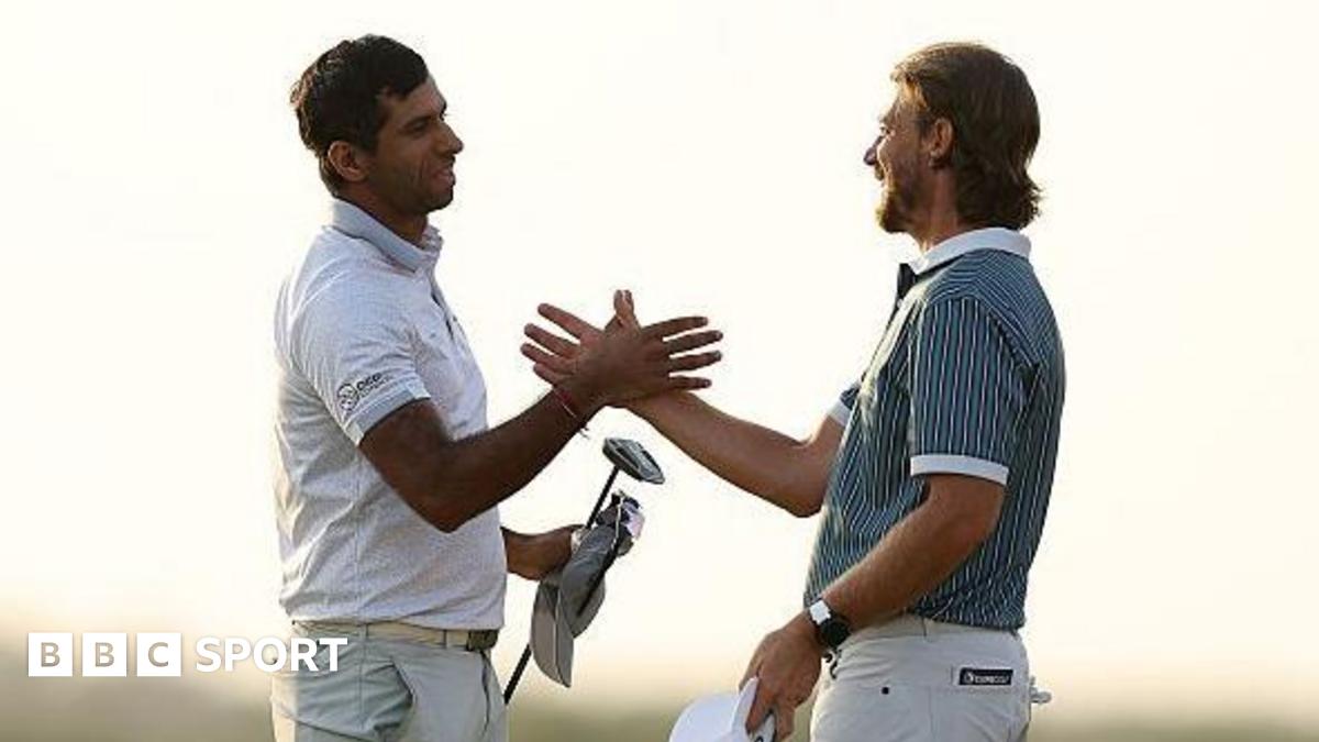 Aaron Rai shaking hands with Tommy Fleetwood after his winning putt.