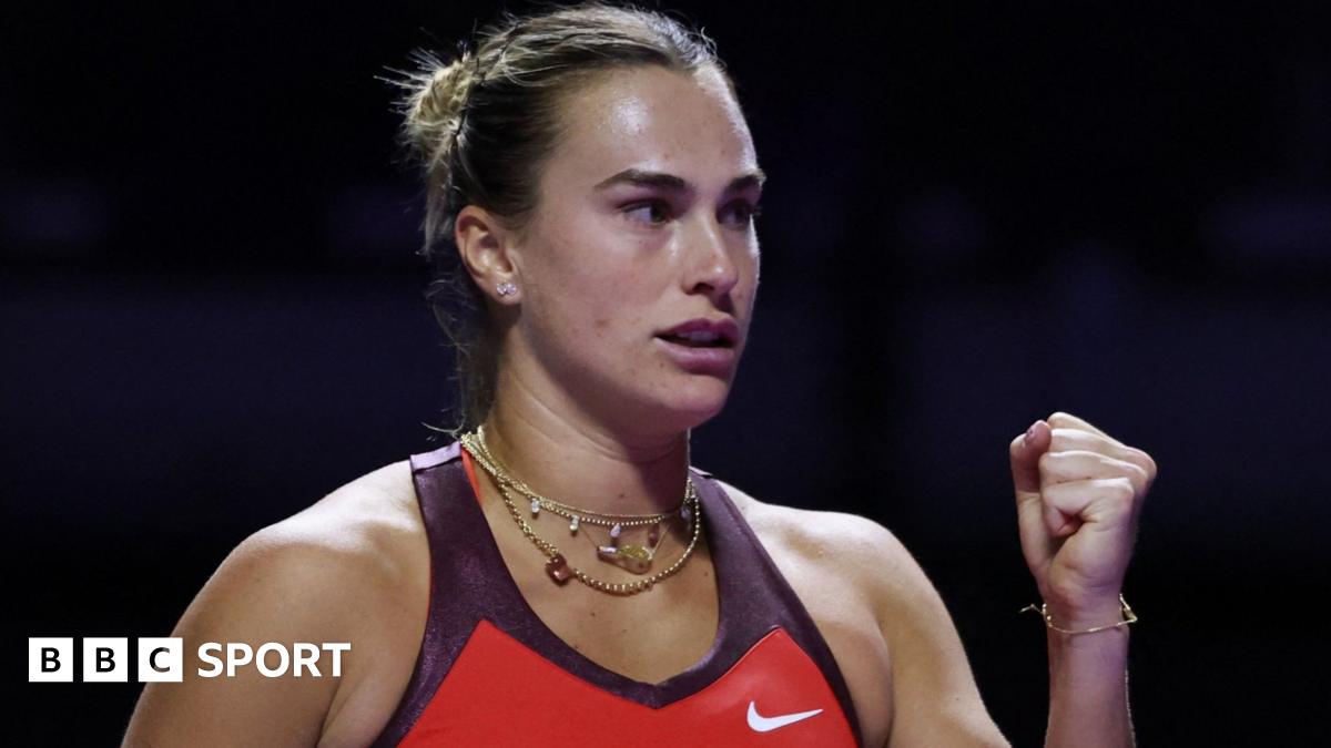 Aryna Sabalenka clenches her fist in celebration at the WTA Finals