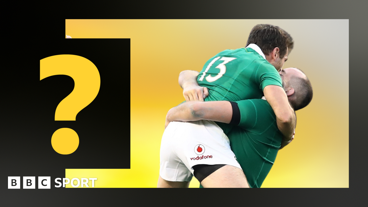 Two Ireland players celebrate defeating New Zealand