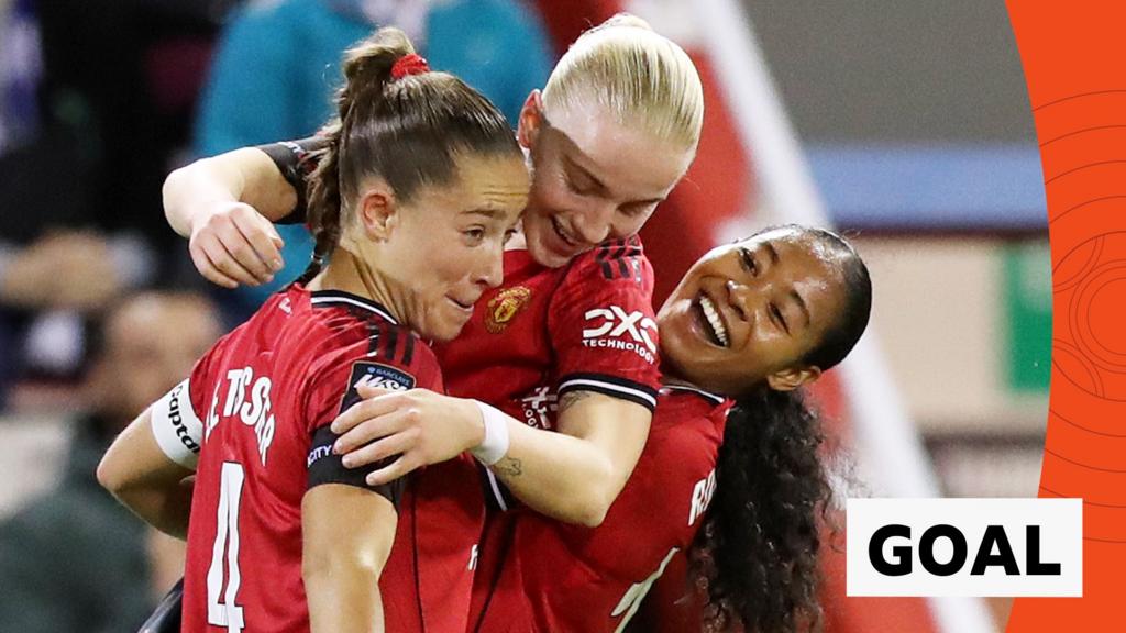 Anna Sandberg celebrates with two Manchester United team-mates