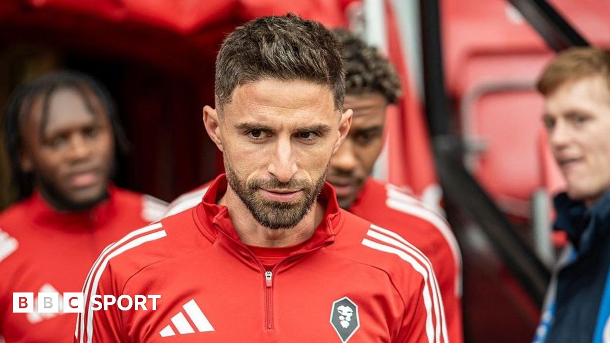 Fabio Borini in a Salford City tracksuit