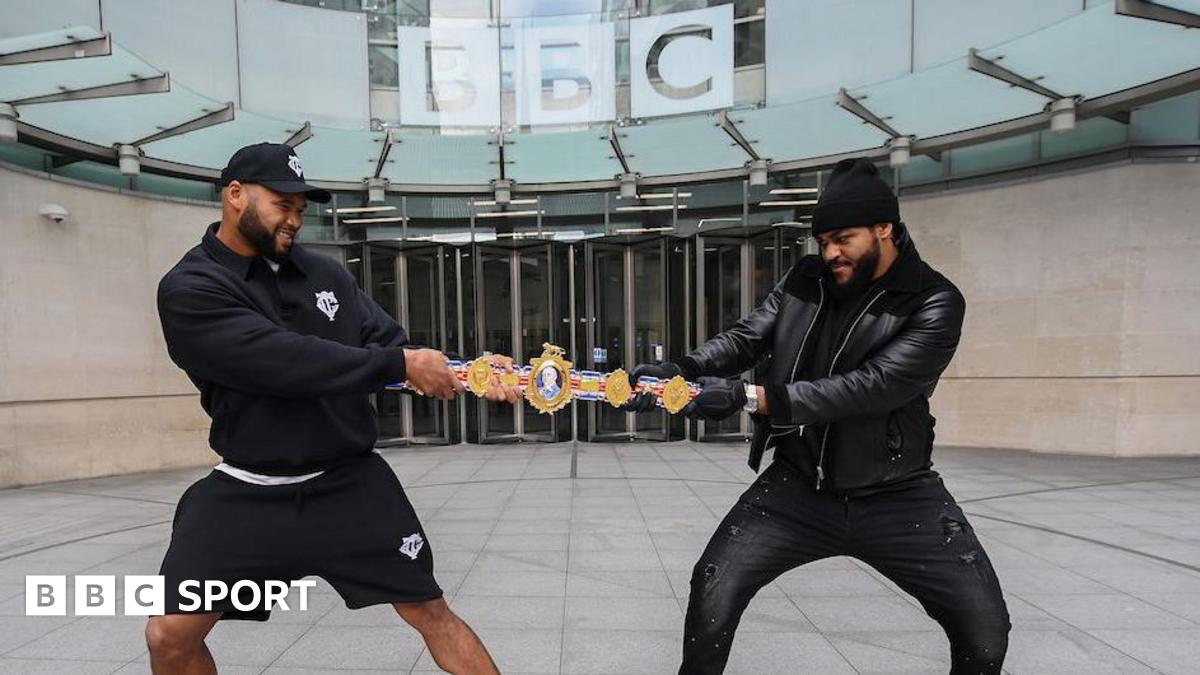 Frazer Clarke and Jeamie TKV play tug of war with the British heavyweight title
