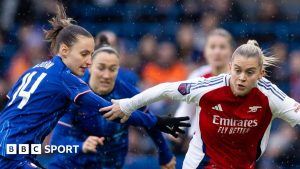 Nathalie Björn of Chelsea and Alessia Russo of Arsenal compete for the ball 