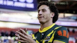 Mark Nawaqanitawase pushes past Jamie Humphries of the Rabbitohs to score in the corner for Roosters in the NRL derby of round 27.