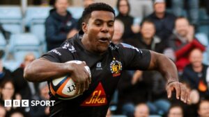Immanuel Feyi-Waboso dives over for his hat-trick try for Exeter