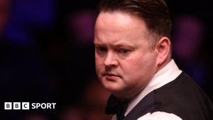 Shaun Murphy looks on