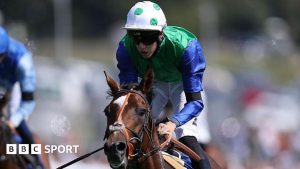 Tommie Jakes rides Gascony to win the Betfred Nifty 50 Nursery race at Epsom in August