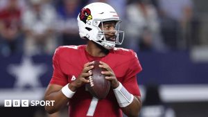 Arizona Cardinals quarterback Jacoby Brissett preparing to throw the ball