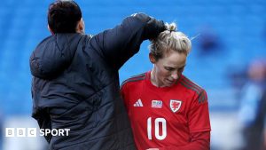 Jerss Fishlock receives a pat from Rhian Wilkinson
