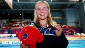 Faye Rogers holding her gold medal