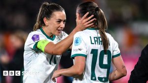Katie McCabe celebrates with Abbie Larkin