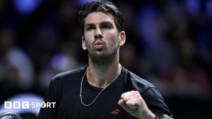 Cameron Norrie punches the air