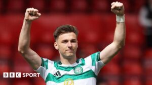 Kieran Tierney salutes Celtic supporters at Pittodrie on 10 August
