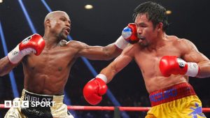 Floyd Mayweather punches Manny Pacquiao during their fight in 2015
