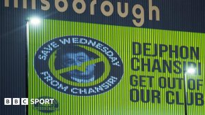 An image of former Sheffield Wednesday owner Dejphon Chansiri projected onto the side of Hillsborough by fans calling for him to go