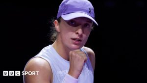 Iga Swiatek celebrates after beating Madison Keys