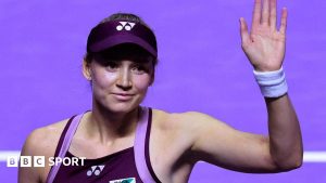 Elena Rybakina waves to the crowd at the WTA Finals